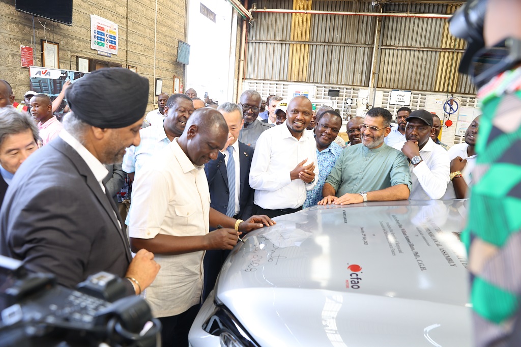 HE President William Ruto autographs the bonet of the locally assembled Toyota Fortuner CKD during the commissioning of the assembly line. Photo / BTV Creations for CFAO Motors Kenya